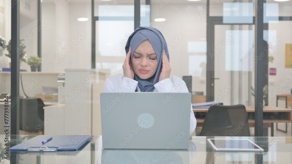 Doctor in Hijab with Headache in Clinic Doctor in Hijab with Headache in Clinic