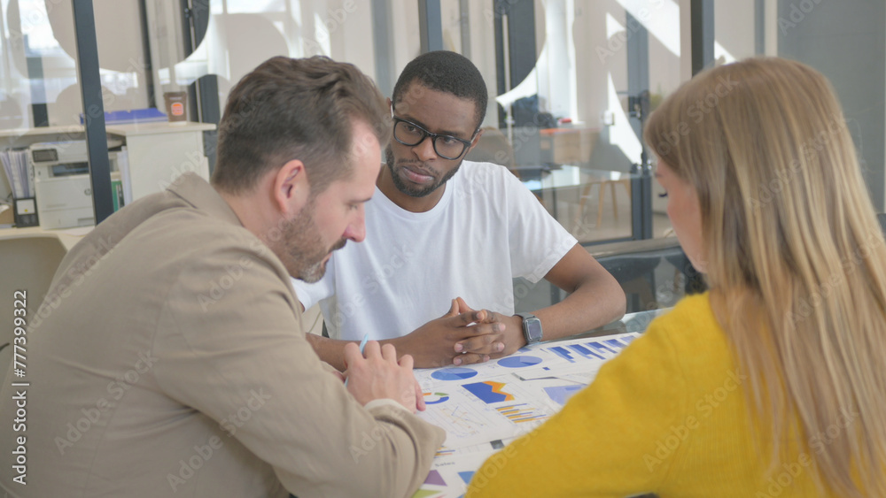 Multi Ethnic People Discussing Business Report Multi Ethnic People Discussing Business Report