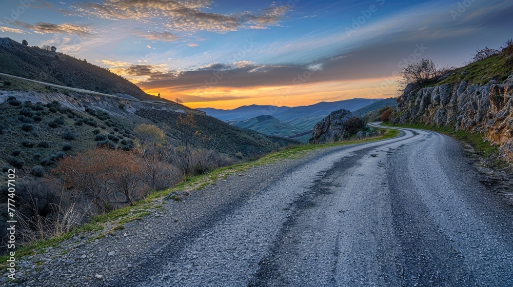 Curvy mountain road snaking through rugged terrain