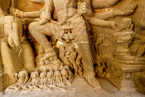 Ellora caves, a UNESCO World Heritage Site in Maharashtra, India. Shiva killing the demon Andhaka at the entrance to the Kailasa (Kailash) temple complex photo