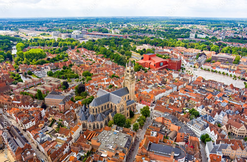 Bruges, Belgium. Cathedral of St. Salvator. City center. Residential areas. Panorama of the city. Summer day, cloudy weather. Aerial view