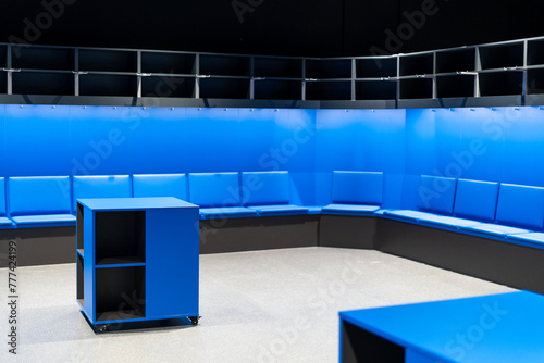 Modern empty sports locker room with blue furniture photo