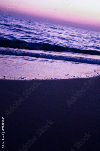 sunset on the beach in oman coastline sea ocean and sand