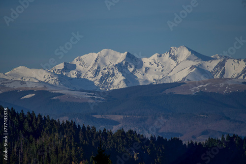 Fagaras Mountains. Viewpoint from the Cozia Mountains, Romania photo