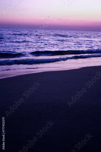 Beautiful sunset on the beach in the evening. Toned.