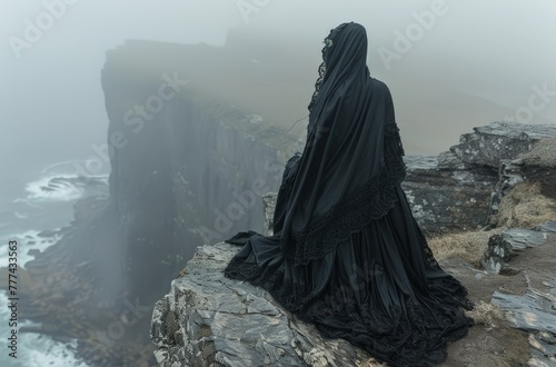 A mysterious, veiled figure in black standing on cliffs overlooking the stormy sea, evoking solitude and contemplation