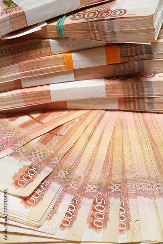 Vertical photo, Russian money, five thousand bills close-up, business concept. Selective focus blur.