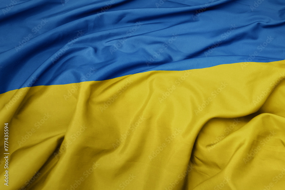 waving colorful national flag of ukraine.