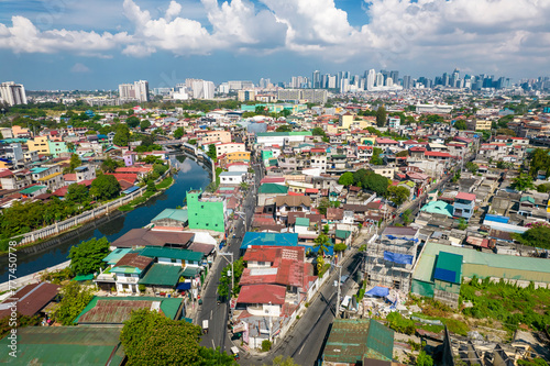 Taguig, Metro Manila, Philippines - Aerial of the Taguig River and the cityscape, with the BGC skyline in the horizon.