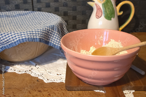 traditional  mixing  bowl   with  wooden  spoon  in old fashion farmhouse