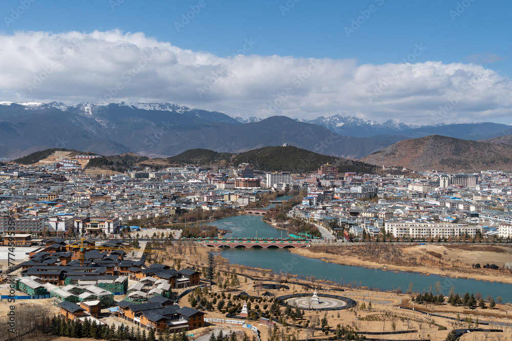 Zhongdian, China: City view of Zhongdian on the Tibetan plateau in the Yunnan province of China with Buddhist temple.
