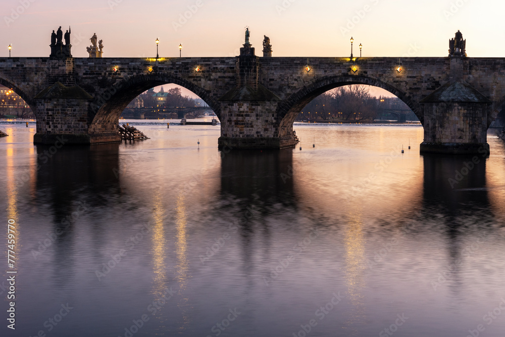 View of the Vltava River and the Charles Bridge in Prague at the sunset. Czech Republic.