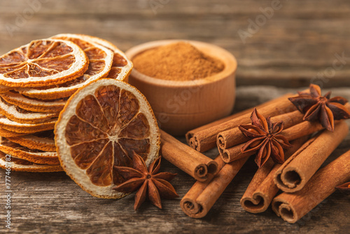 Ceylon cinnamon sticks and anise on a textured wooden background.Cinnamon roll and star anise. Spicy spice for baking, desserts and drinks. Fragrant ground cinnamon.Place for text. copy space.