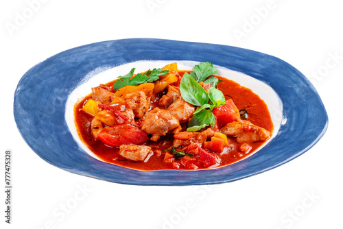 Roast chicken stew with vegetables and tomatoes served in a plate on a white background. Chakhokhbili made from chicken pieces, Georgian cuisine