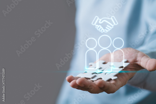 Human Resource Management, Hand holding Magnifier glass focus to manager icon which is among staff icons for human development recruitment leadership and customer target group concept. 