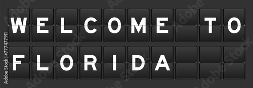 Black color analog flip board with word welcome to florida on gray background