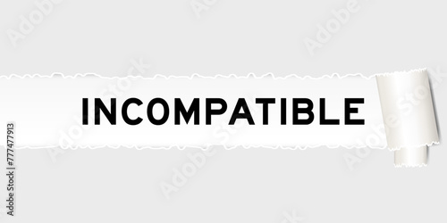Ripped gray paper background that have word incompatible under torn part