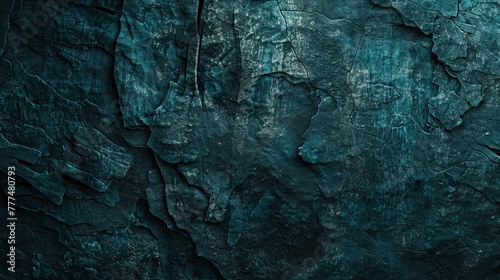 A dark teal rocky surface resembling an ancient, eroded wall. The texture is deeply grooved and weathered, giving it a historical feel. photo