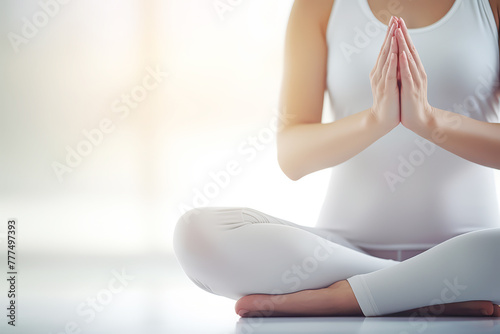 A woman do yoga in white clothes in the indoor. Health fitness concept