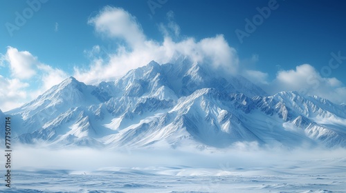  A mountain range, blanketed in snow, lies beneath a clear blue sky Soft, white clouds populate both the foreground and background
