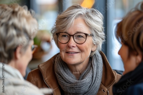 Two women with glasses having a conversation