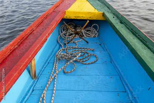 Anchor on a boat painted with the colors of the national flag on a waterway in Saloum, Senegal photo