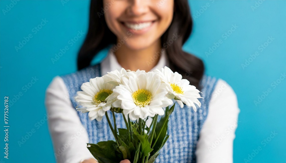 Cropped photo of charming happy young woman smile give you receive flowers isolated on blue background Cropped photo of charming happy young woman smile give you receive flowers isolated on blue background