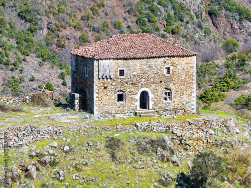 Aerial image of a historical abandoned fortified house build on the top of a rocky hill over 200 years ago in a remote village of northern Albania called Bukmire (in Mirdita region)