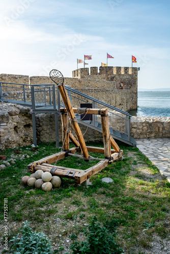 Ancient medieval catapult replica and cannon balls at the Golubac fortress in Serbia. Europe.