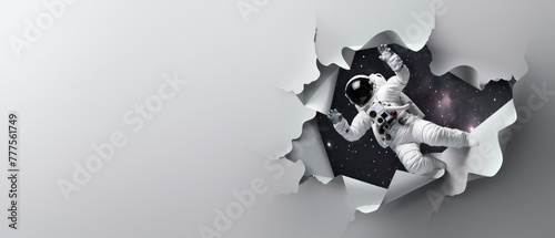 A creative depiction of an astronaut emerging from paper into a starry space as a metaphor for discovery