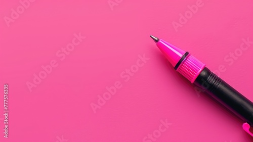 Bright pink felt-tip pen on vibrant background, with room for text or design elements photo