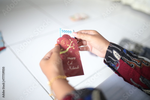 Amplop hari raya or THR or Angpao or Envelopes filled withfifty thousand money to give to children during Eid al-Fitr. Eid celebration.