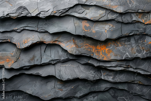 Textured Slate Rock Surface with Orange Accents photo
