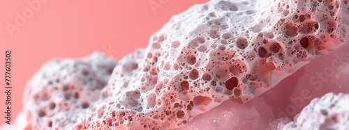 Macro image highlighting the delicate structure and intricate patterns of Pumice texture against a pink background photo