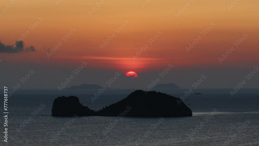 Minutes before sun down, behind a whale shape island Minutes before sun down, behind a whale shape island