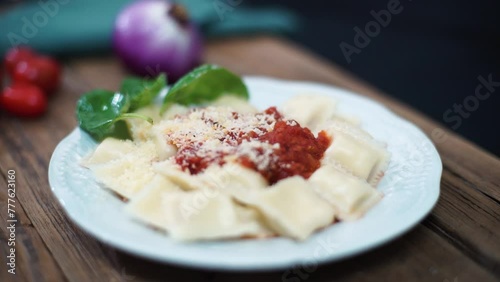 Sorrentinos with tomato sauce on a plate photo