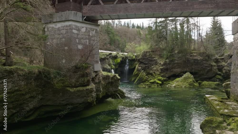 A slow cinematic shot of Traunfall Austria with approach under the bridge A slow cinematic shot of Traunfall Austria with approach under the bridge