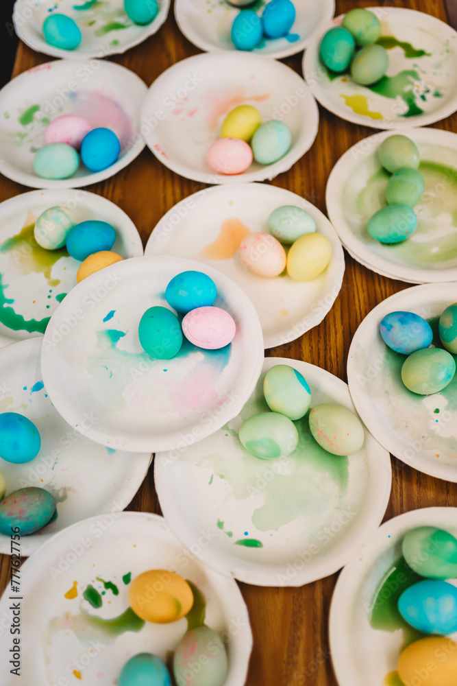 Overhead view of plates with colored Easter eggs Overhead view of plates with colored Easter eggs