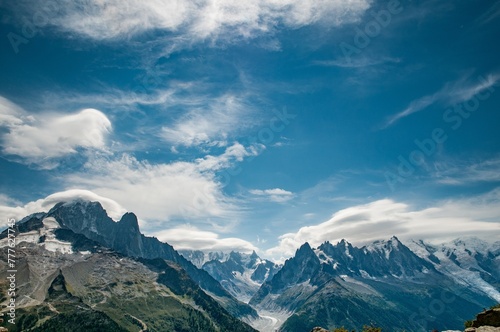 Panorama from Aiguille Verte to Mont Blanc with stunning cloudy blue sky © FaiV007
