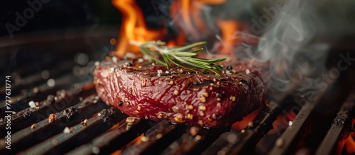 A steak sizzles and cooks on a grill, surrounded by intense flames, creating a charred and flavorful crust on the meat.