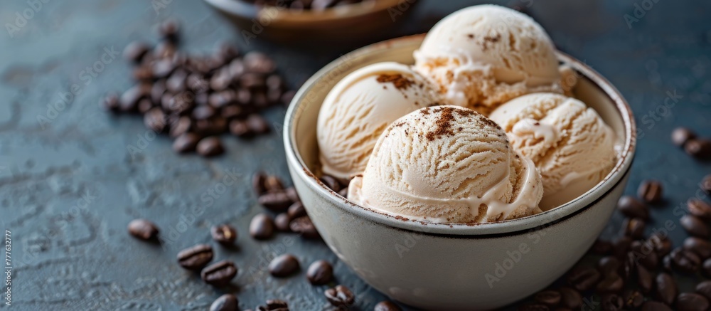 A bowl filled with creamy ice cream sits surrounded by aromatic coffee beans. The contrast of cold and creamy against the rich and bold coffee beans creates a visually striking scene.