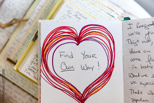 Hand drawn heart in journal with encouraging message photo