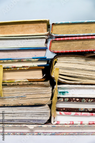 Closeup cropped photo of a stack of used journals