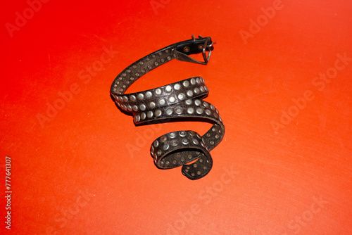 Rock/punk style metal silver stud leather belt with hard direct flash