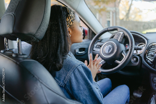 young woman getting ready to drive photo
