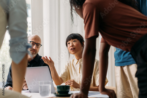 Colleagues talking in office