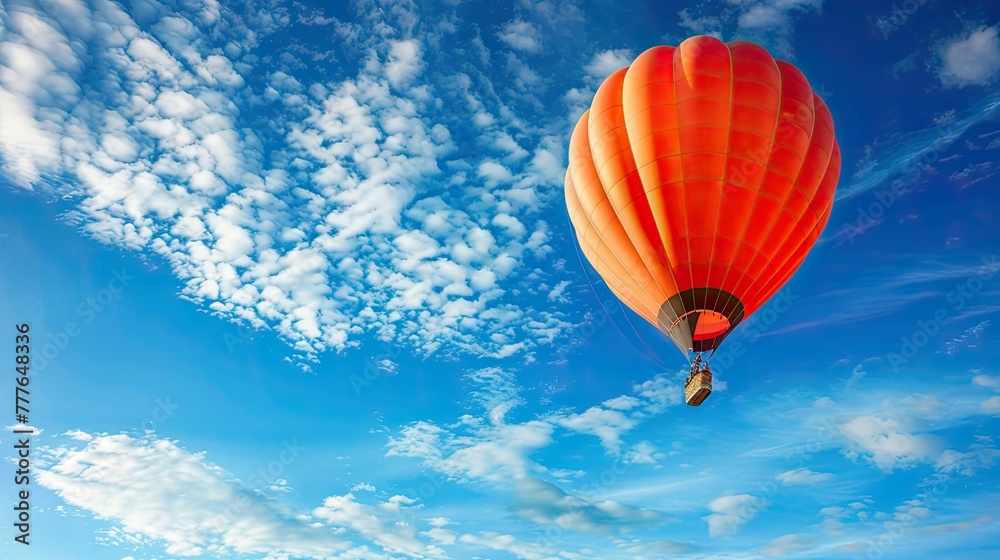 Fototapeta premium hot air balloon soaring high in the endless blue sky!