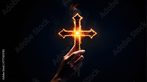 Hand on a dark background, clutching a glowing fire cross shape
