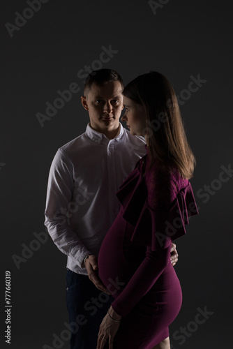 portrait of a couple, pregnant couple, pregnancy woman in a dress