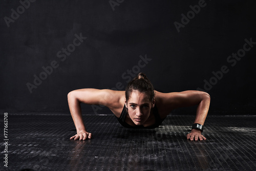 Fitness, push up and portrait of woman in studio for arm muscle training with mockup space. Sports, workout and female athlete with strength exercise for health or wellness by black background.